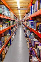store aisle with book shelfs, library no people, diminishing perspective
