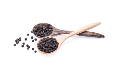 Wooden spoon and black peppercorn on white background