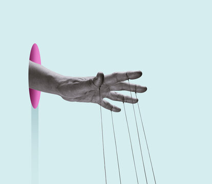 A puppeteer's hand with strings on each finger. Art collage.