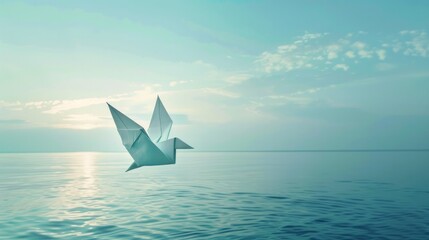 Obraz premium Conceptual photos depict the freedom of a white origami dove or pigeon flying from the water into the sky symbolizing peace human rights love and hope particularly relevant for