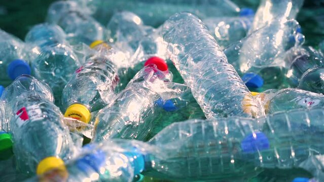 Environmental Issues: plastic waste in the ocean. Problem of ecology: many plastic bottles and garbage get into rivers.
Garbage floating on the coast. Environmental pollution Rubbish plastic bottles. 