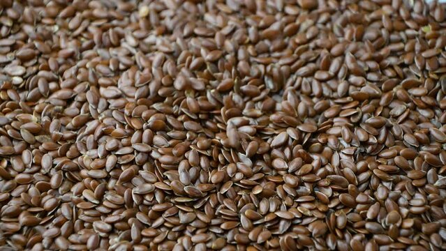 Brown flax seeds, close-up. Plant source of Omega-3. Plant nutrition.