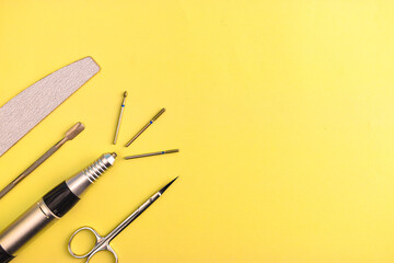 manicure tools on a plain background, flat lay, space for text banner, copy space