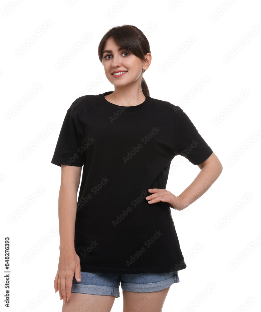 Wall mural Smiling woman in stylish black t-shirt on white background