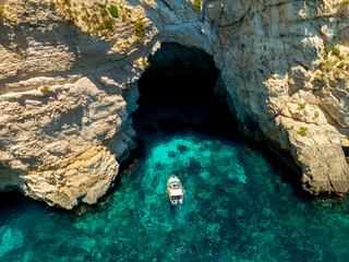 The famous arch and cave in Malta. The name is blue grotto.