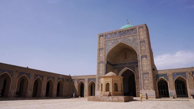 View of Kalan Minaret Emir and Alim Khan madrasah of Po-i-Kalan (Poi Kalan) - islamic religious complex Bukhara, Uzbekistan