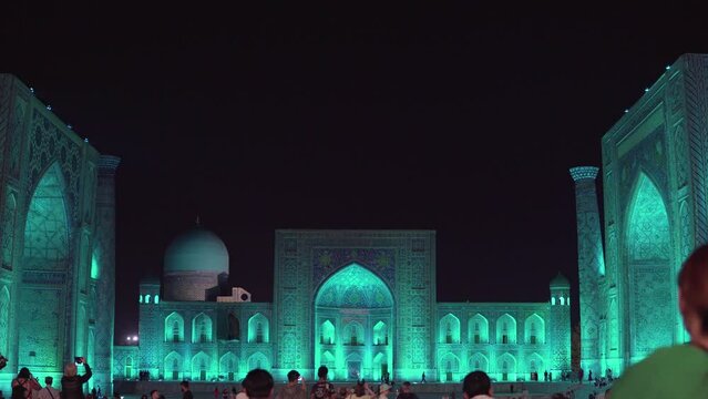 Night view of The Registan Square. Ulugh Beg Madrasah,  Tilya-Kori Madrasah. A popular tourist destination of Central Asia. Colorfull Registan square at night. Samarkand, Uzbekistan Drone 