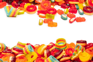 Assorted colorful gummy candies. Top view. Jelly donuts. Jelly bears. Isolated on a white background.