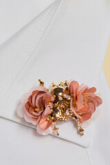 Decorative handmade brooch in the shape of a beetle on the collar of a shirt