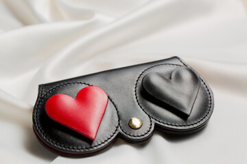 A case for glasses made of genuine leather with hearts on a white background