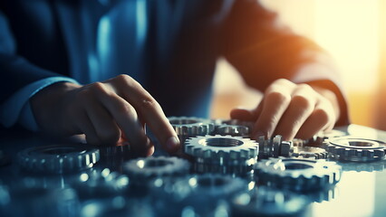 A person is arranging gears on a table