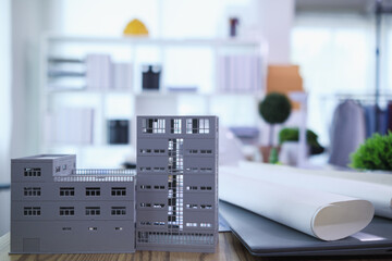 Engineers are reviewing plans from architects to prepare to install solar panels and wind turbines on the building to efficiently produce electricity using the concept of green energy from solar cells