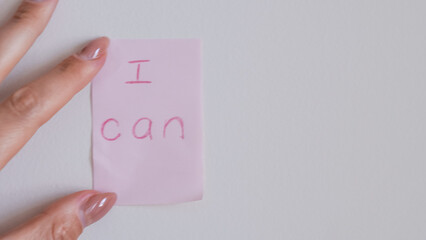 Obraz premium motivational quote on pink sticker inscription I can