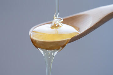 honey dripping from a spoon