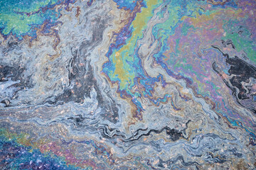 Slick industry oil fuel spilling water pollution. Water with patches of gasoline and oil