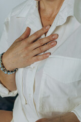 Obraz premium Attractive young woman practing yoga stretching yoga at home. 