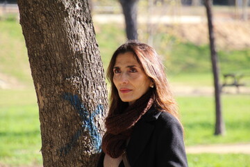 portrait of a woman by a tree