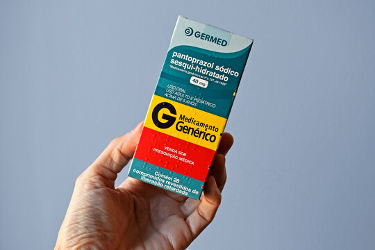 RIO DE JANEIRO, BRAZIL - JUNE 25, 2022: Hand holding a box of generic drug Pantoprazole