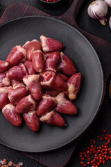 Raw chicken hearts with salt, spices and herbs