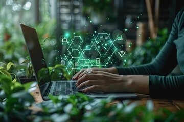 A woman is typing on a laptop with a green screen that has a lot of icons
