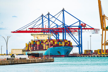 Fototapeta premium Port in Malaga, container terminal. Container cargo freight ship in port. Spain