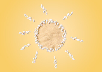 sun made of seashells and sand on a yellow background, summer concept