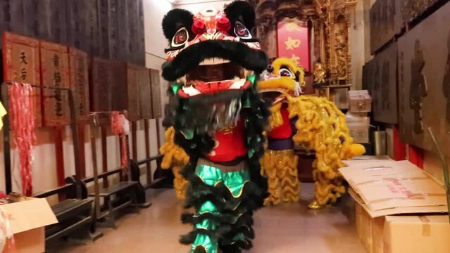 Lion dance perfprmance in the temple of Kuala Lumpur China town Malaysia