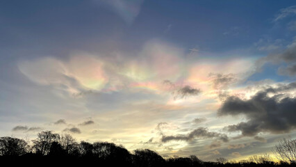 nacreous pearlescent iridescent clouds in the sky