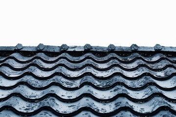 Abstract black and white pattern of roof tiles, creating a visually striking and textured design