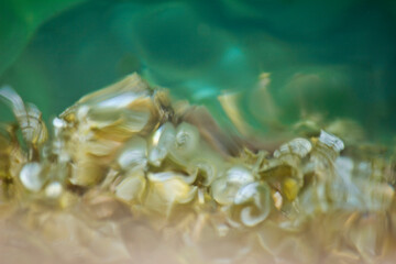 abstract blurred background with highlights in sea water closeup