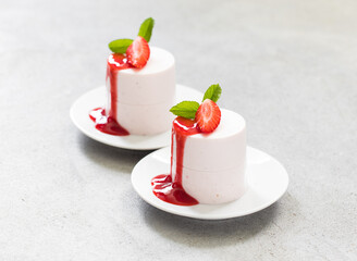 Strawberry Cream pudding, Panna Cotta with strawberry sauce. On a plate. Close up