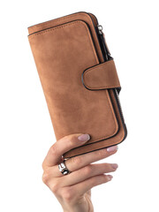 Close-up of female hand elegantly holding textured vibrant brown suede wallet with multiple compartments isolated against white background. Concept of brightness and individuality in personal style