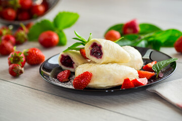 cooked sweet homemade steamed dumplings with strawberries