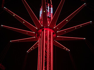illuminated carousel in a city at night.