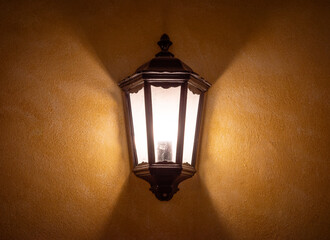 the old lantern on stone wall