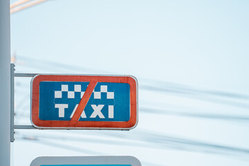 A sign for not parking a taxi