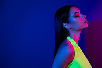 Profile photo of tender peaceful model girl closed eyes empty space isolated on magenta neon background