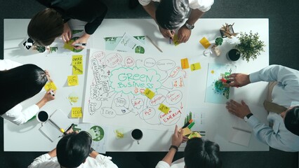 Top down view of business team discussing about using clean energy and sustainable investment at...