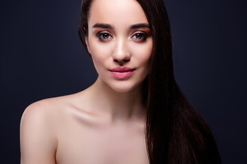 Fototapeta premium Photo of tender gentle girl with long brunette hair look isolated dark color background