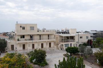 A quiet and hidden lane in the historic part of the Cypriot town of Nicosia,and unrecognizable woman with her back