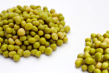 Canned green peas on white background.