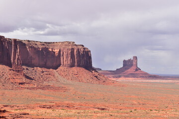 View of the Sentinel Mesa and Stagecoach red sandstone formation in Monument Valley, AZ