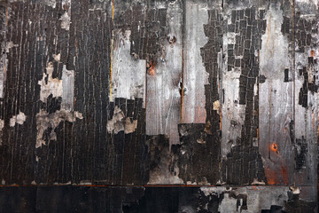 Burned wooden texture background. Burnt wooden surface