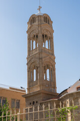Fototapeta premium Nicosia,Cyprus - November 03, 2023. Bell tower a part of monastery in the southwest of the island. An important Orthodox pilgrimage site.