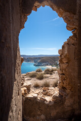 Window in Ruins Overlooking Sunny Blue Sea