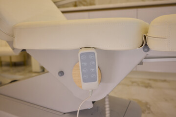 Modern spa with white massage chair and luxurious marble flooring for serene relaxation