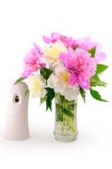 bouquet of spring flowers in a vase and air freshener