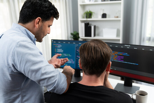 IT developers creating online software development information on screen laptop with coding program in data of application and website. Technical engineer coder on safety program concept. Sellable.