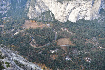 View of the campgrounds and Merced river down in Yosemite Valley as seen from Four Mile Trail in Yosemite National Park
