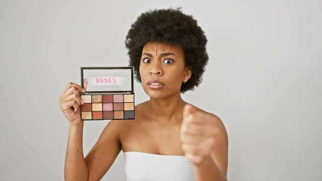 Furious african-american woman with makeup, yelling and shouting in crazy anger and frustration, isolated on a white background